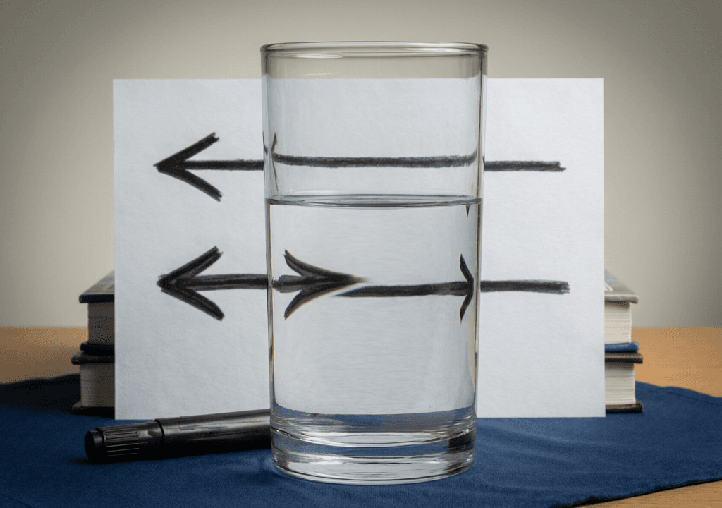 Two Arrows Behind a Glass of Water